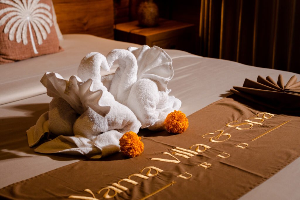 Bedroom interior at Yama Villa & Spa Ubud with Balinese-inspired wooden design