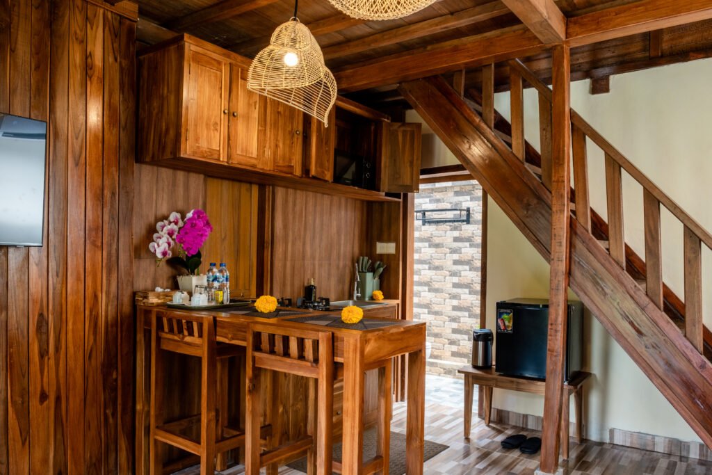 Wooden kitchenette and living area inside Yama Villa & Spa Ubud