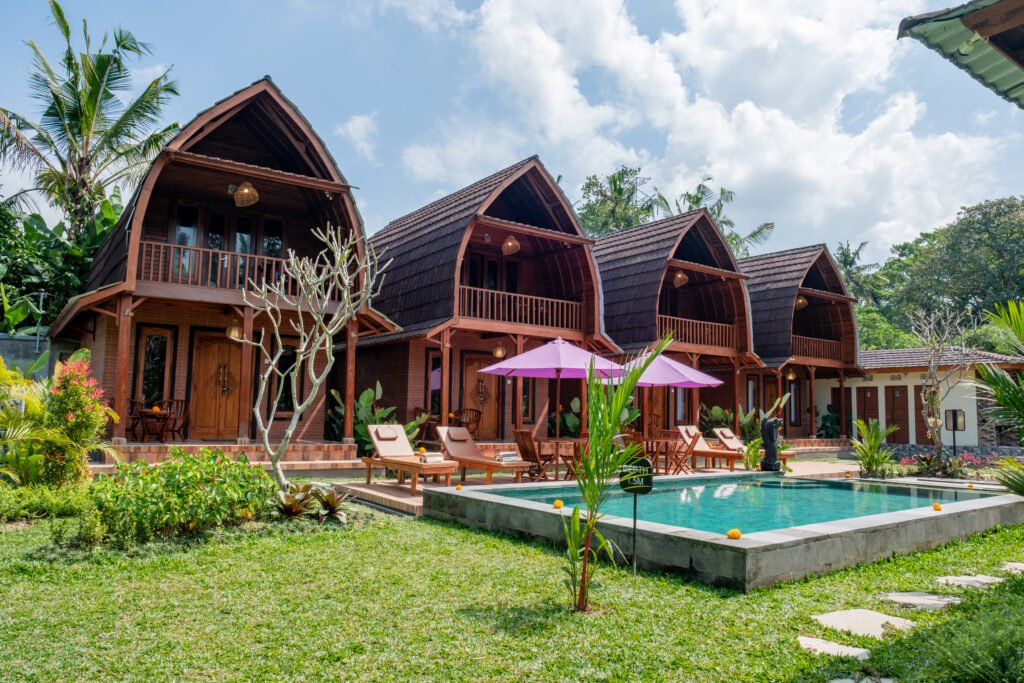 Wooden terrace seating at Yama Villa & Spa Ubud with Balinese-inspired details
